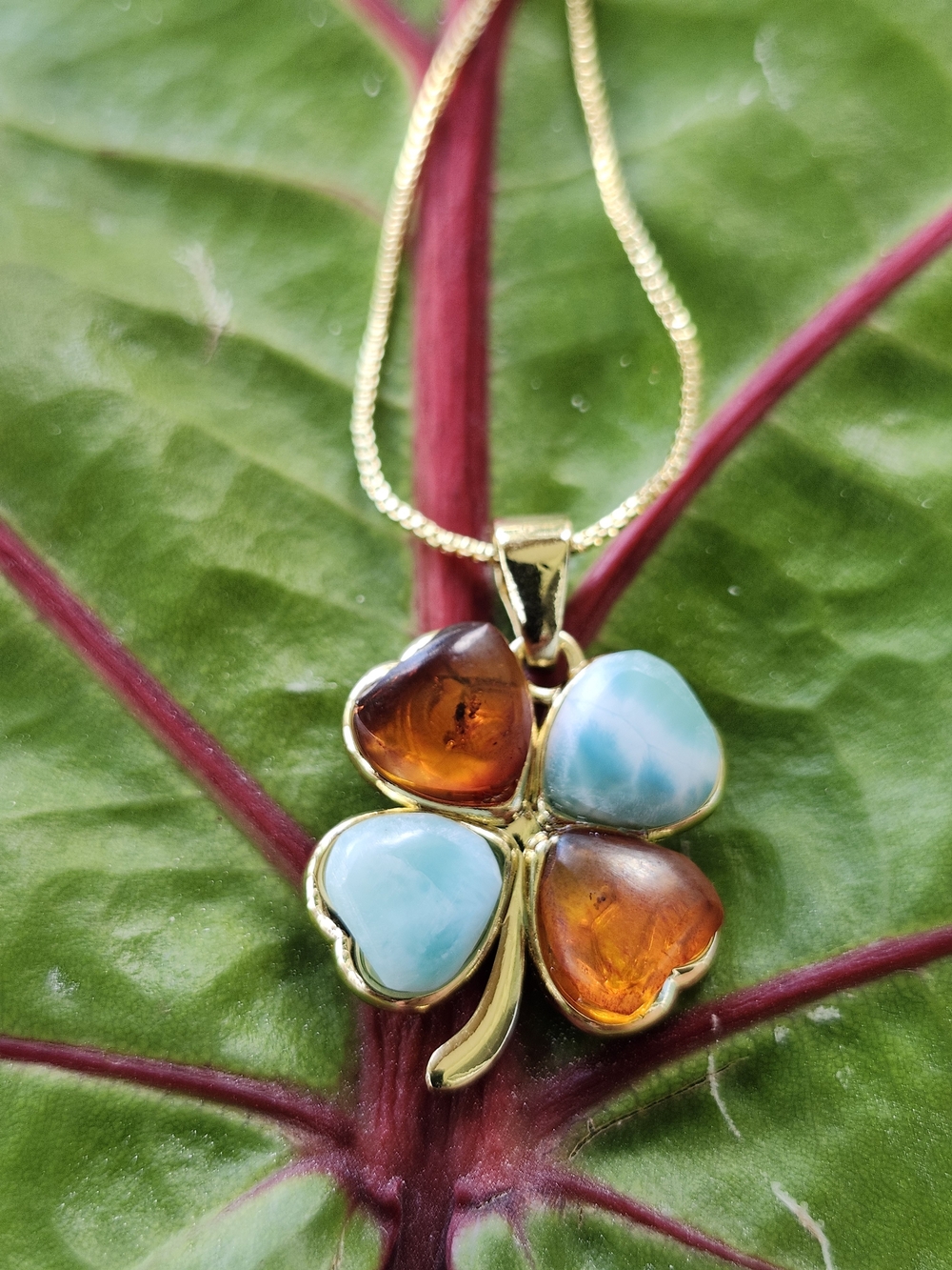 Gold Clover Pendant Necklace with Blue and Amber Heart Stones